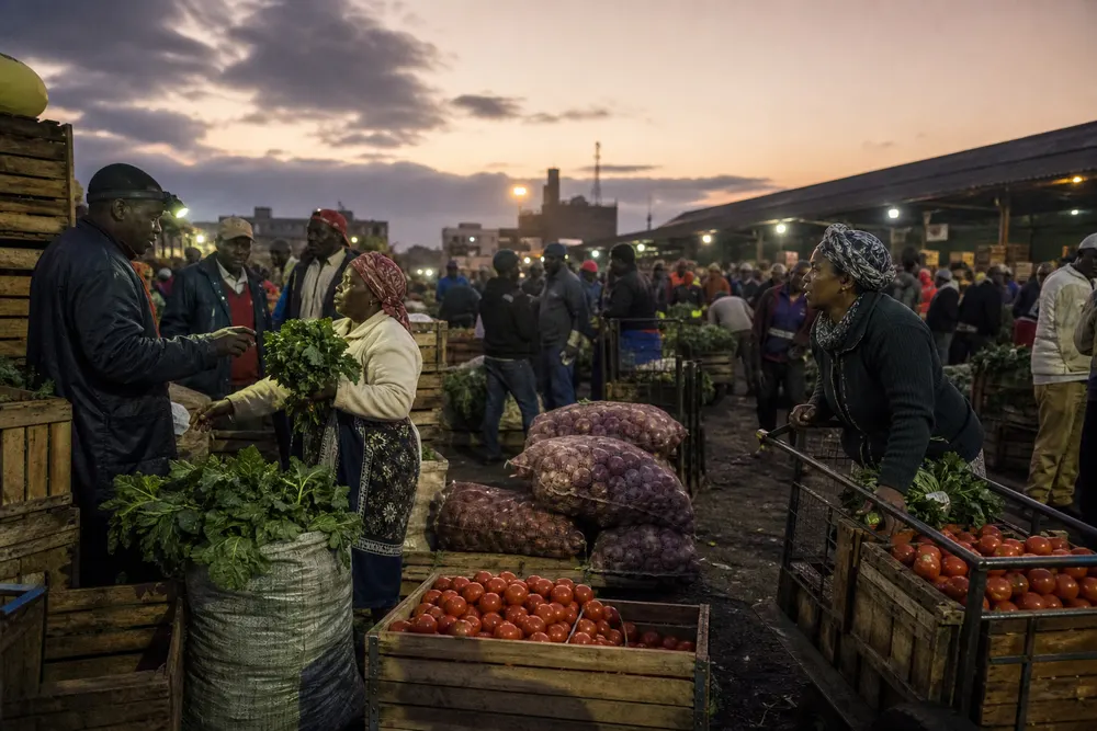Early morning vegetable buying at Wakulima Market
