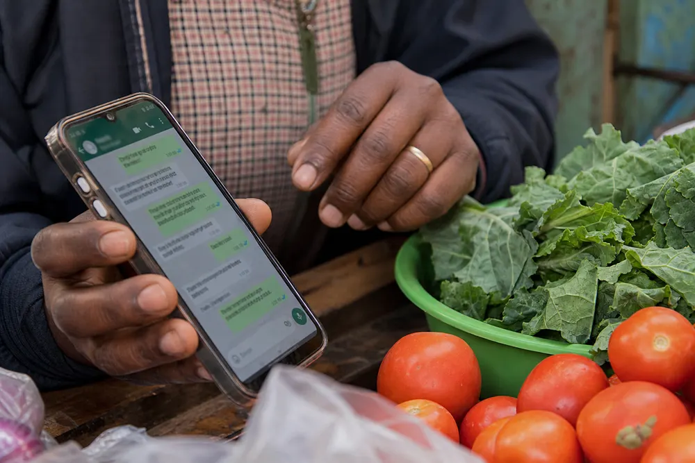 WhatsApp vegetable orders at a Kenyan mama mboga stall